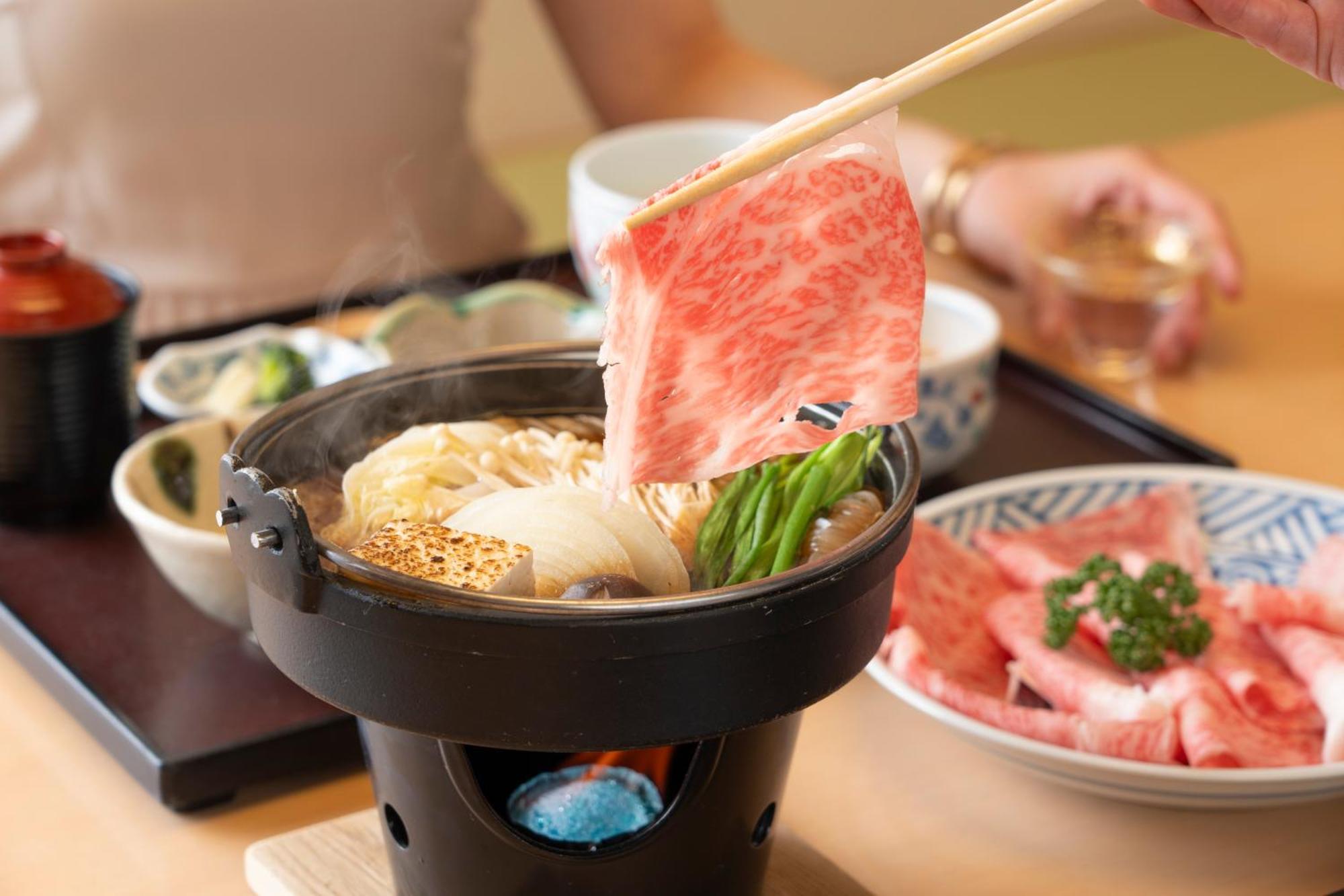 Hotel Associa Toyohashi Exterior photo A piece of Kobe beef being cooked in a pot